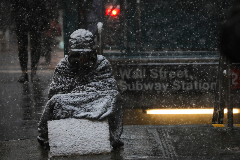 Illustration for article titled This Viral Photo of a Homeless Person Freezing on the Street Is Actually From 2013... in Canada